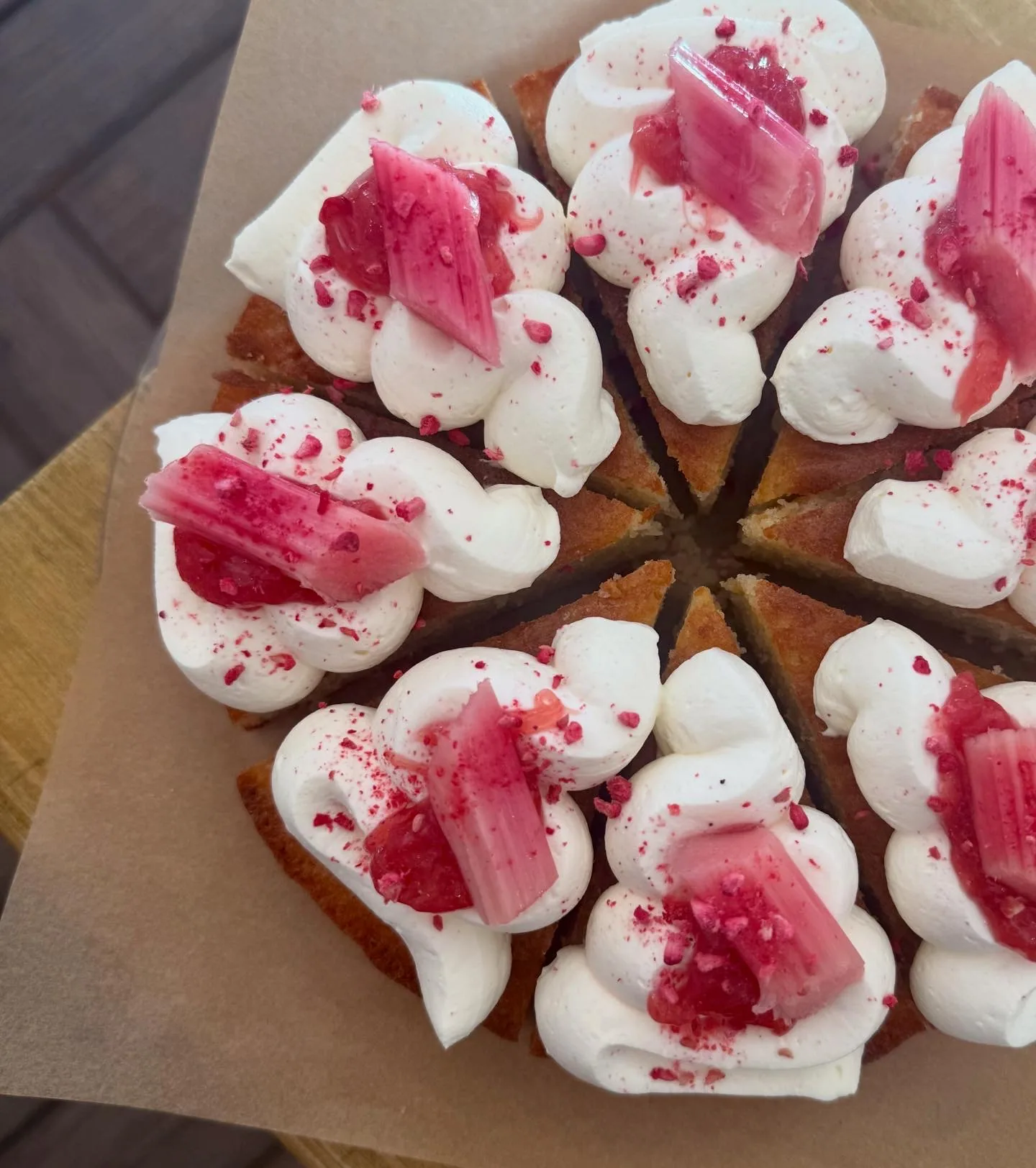 Small cakes with cream and pink toppings at Arlo