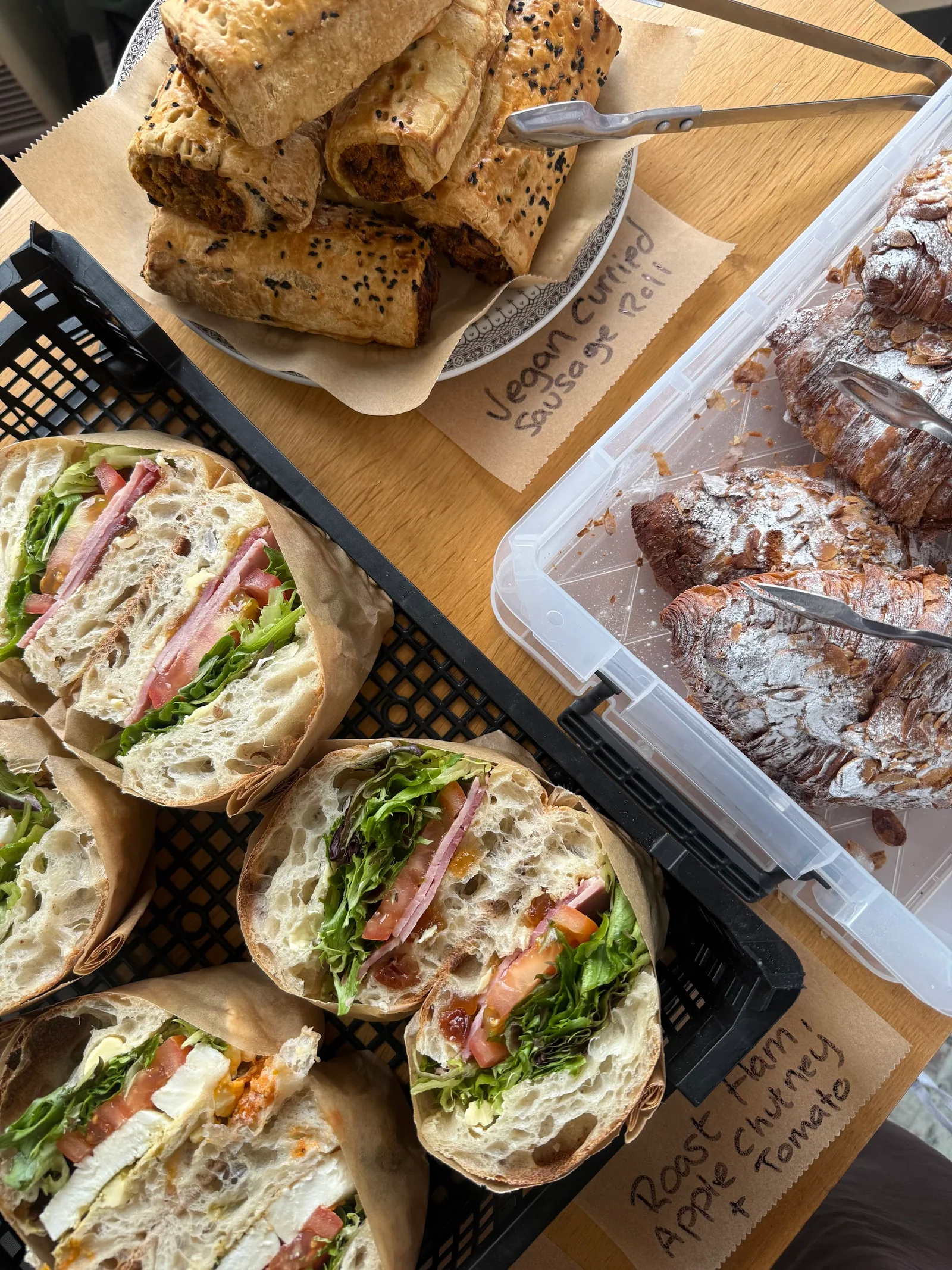 Sandwiches and sweet and savoury pastries on the counter at Arlo